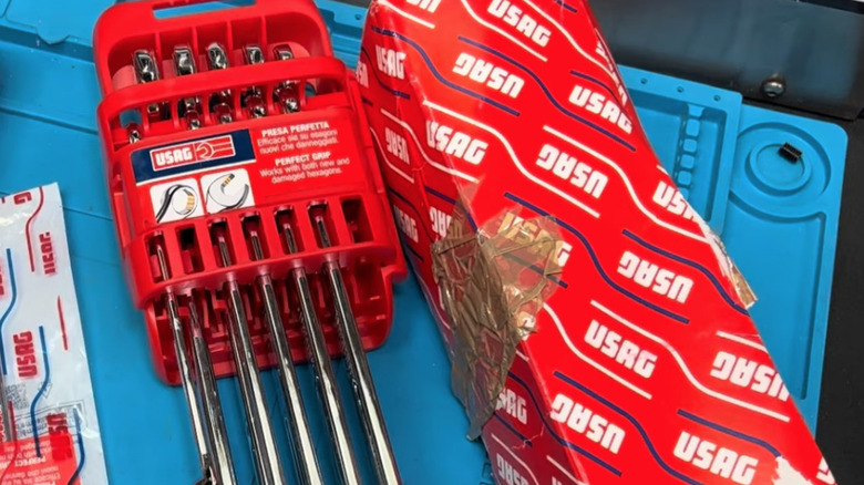 USAG wrenches and box on blue workbench