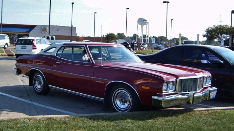 Front quarter view of red 1975 Ford Gran Torino parked