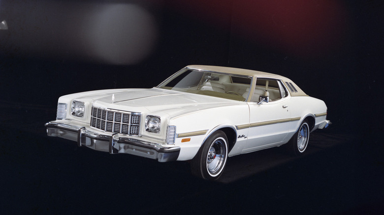 Front quarter view of white 1974 Ford Gran Torino in studio