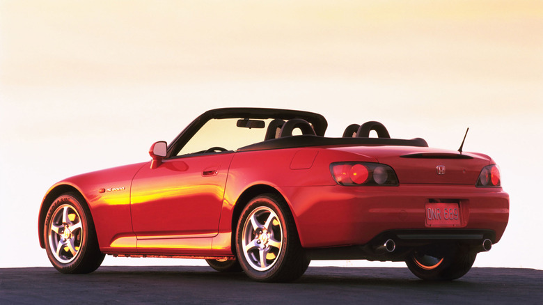 Red 2000 Honda S2000 parked at sunset