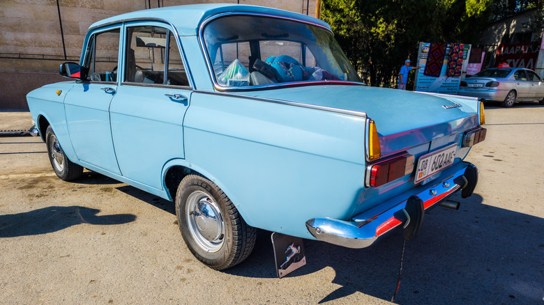 Anti-static attached to a vintage blue car.