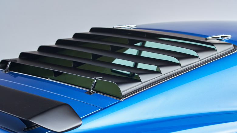 Rear window louvers on a blue 1969 Ford Mustang