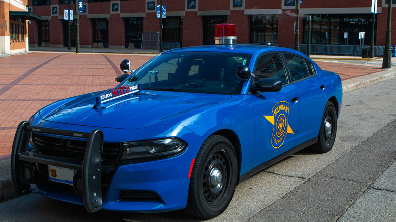 A Michigan State Trooper police vehicle sits parked outside Comerica Park, home of the Detroit Tigers baseball team.