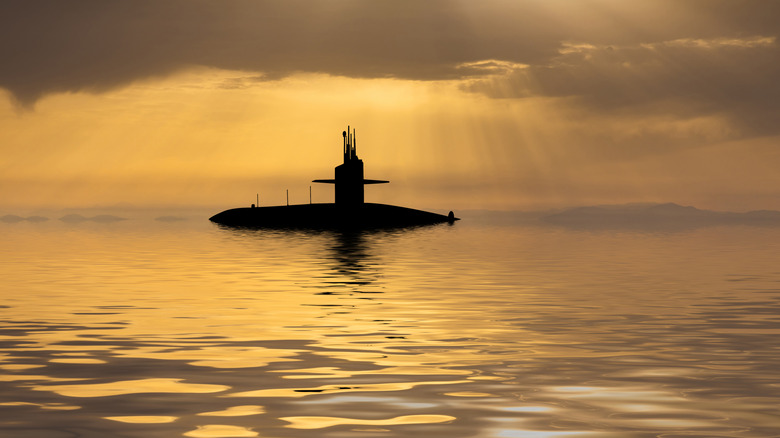 Submarine sail sticking out of the ocean