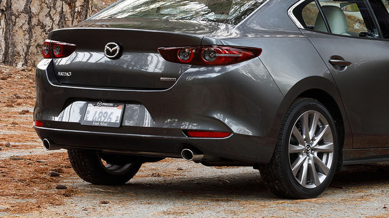 Rear 3/4 view of a black 2019 Mazda3 sedan