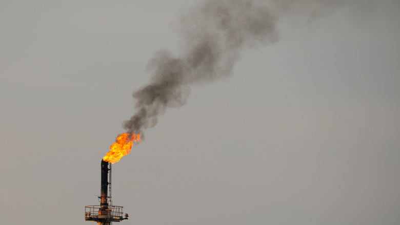 Black smoke and soot from oil rig gas flaring