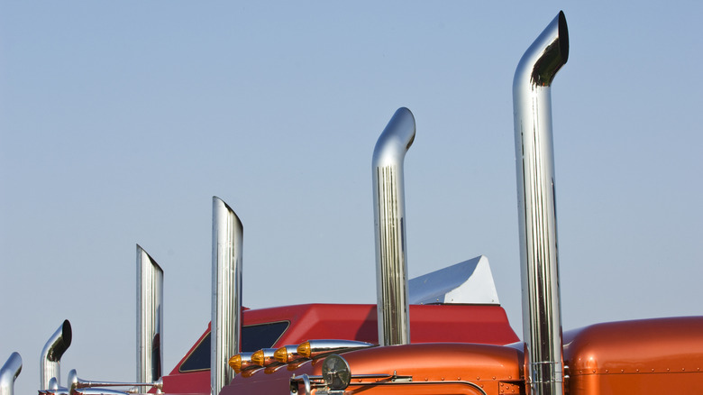 Semi truck exhaust stacks lined up