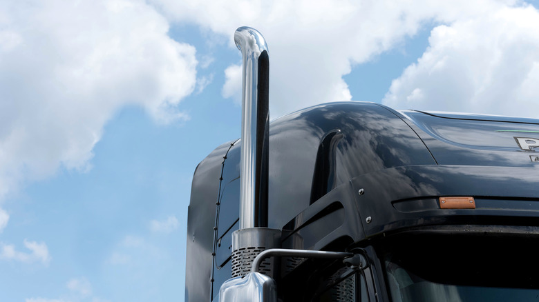 The exhaust stack on a black semi-truck