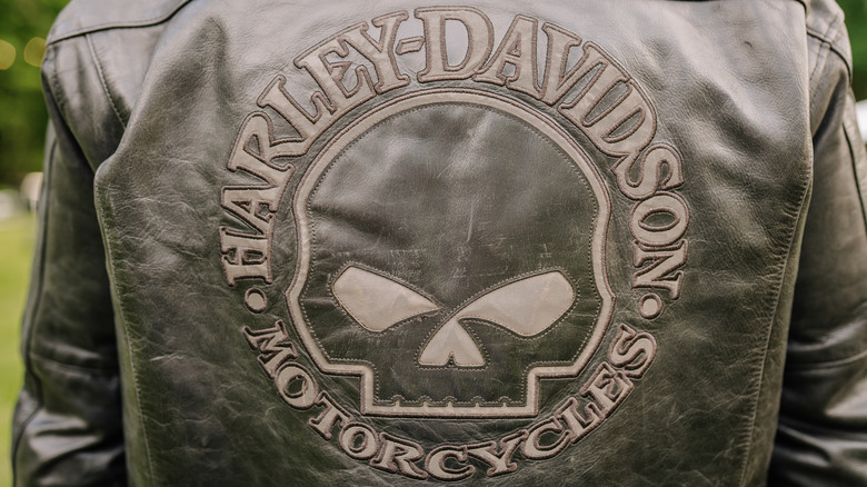 Close-up of a leather jacket featuring a Harley-Davidson Motorcycles skull emblem
