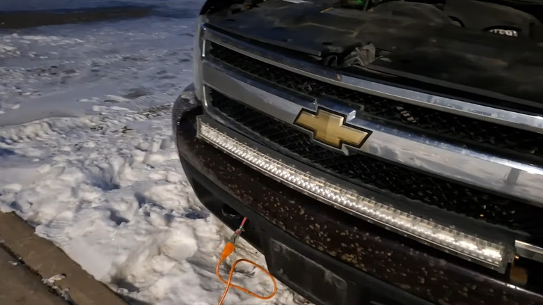 Car with frontal electrical plug