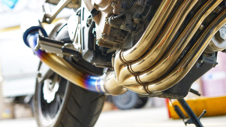 Close up to motorcycle exhaust turning blue