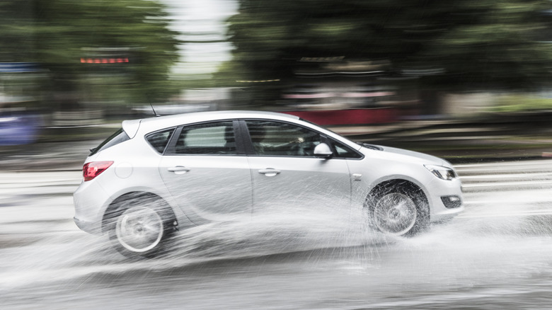 Car driving fast on water