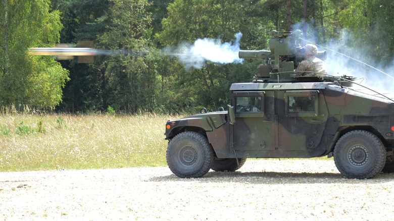 A TOW missile is fired from a military Jeep