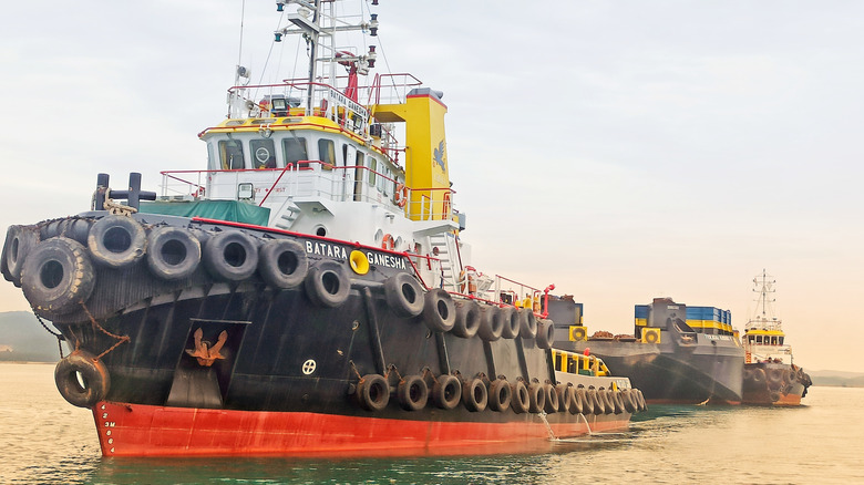 Tugboat with tires pulling load