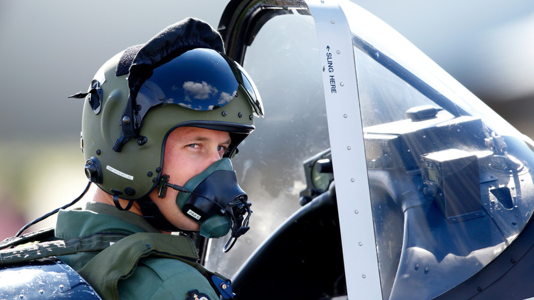 Pilot with oxygen mask looking back