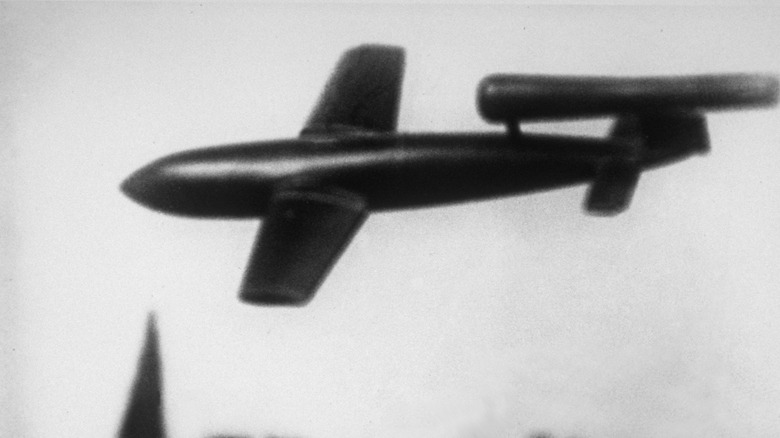 A V-1 flying bomb in-flight, left-side view, original World War II photograph.