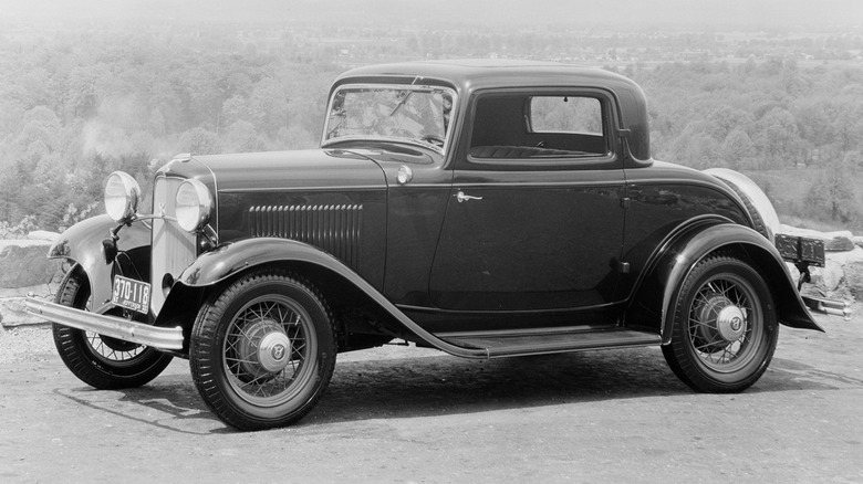 1932 Ford DeLuxe Coupe parked black and white photo
