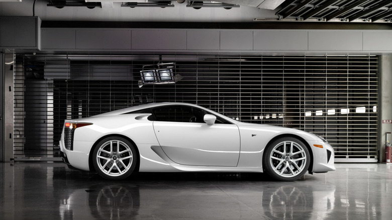 A white Lexus LFA pakrked in a garage.