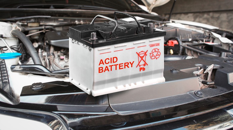 Automotive acid battery on car engine bay