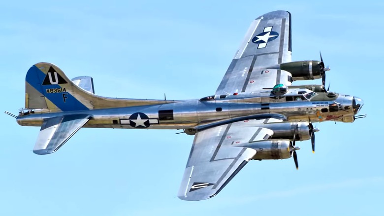 A Boeing B-17 Flying Fortress flying over blue skies