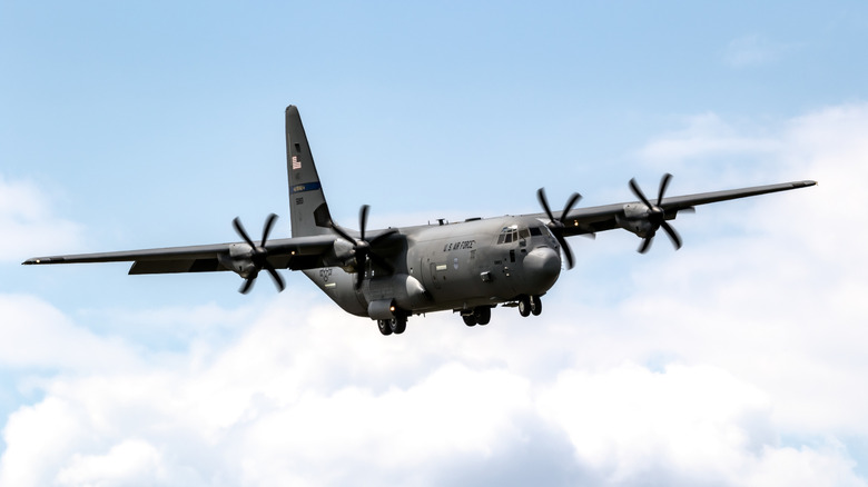 A C-130J flying through the air.
