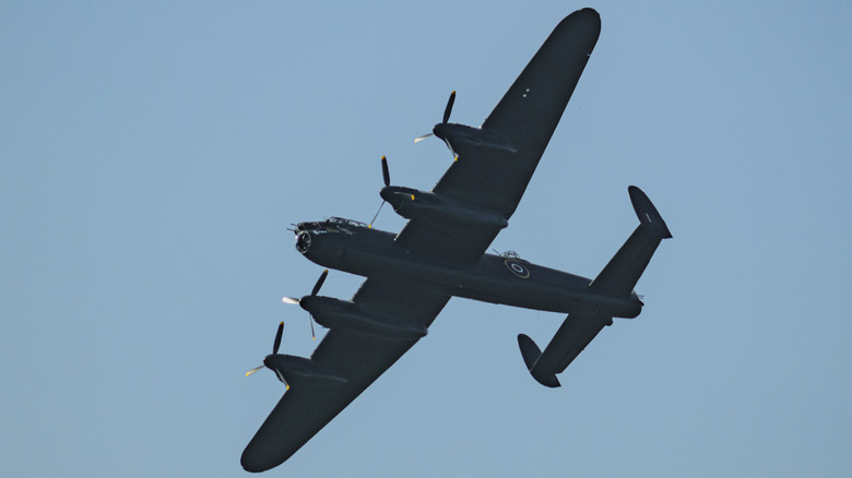 An airplane with multiple propellers flying.