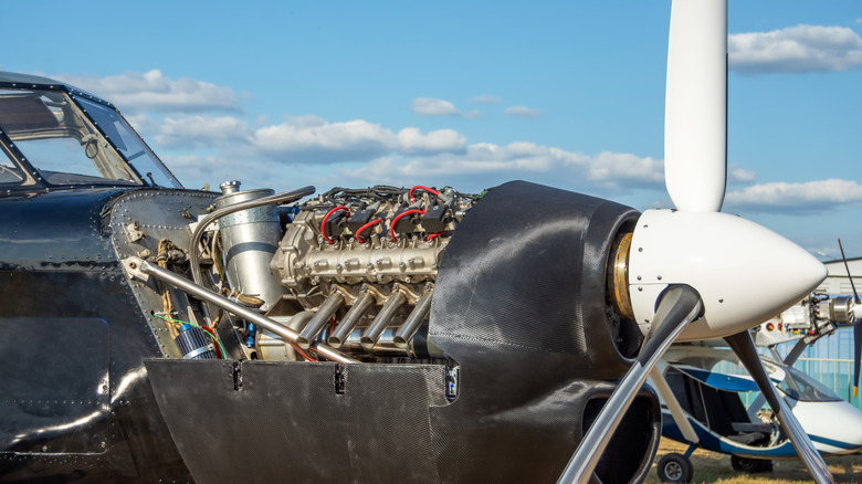 A piston engined plane with the engine cover open