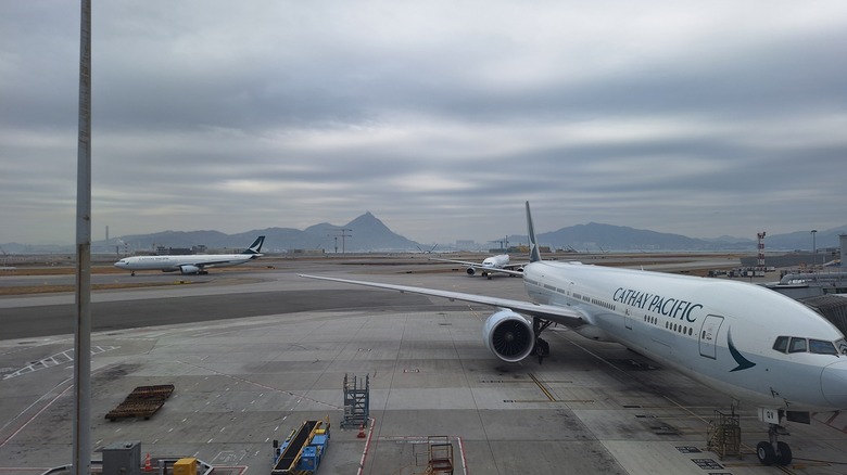 Airplanes of Cathay Pacific parked at airport ramp in Hongkong Airport