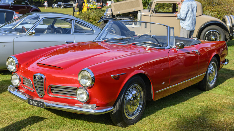 A red Alfa Romeo 2600 at a car show.