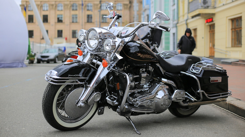 Black Harley-Davidson Road King parked in lot
