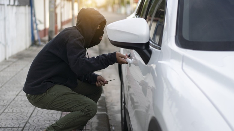 An image portraying an attempt to steal a car