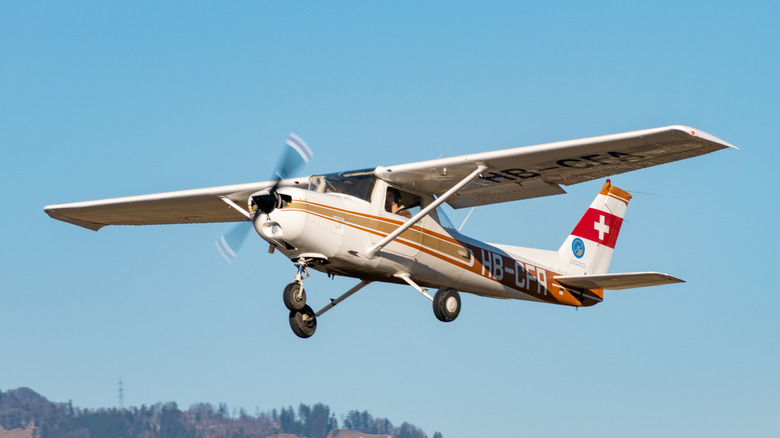 Underside view of a Cessna 152 in flight