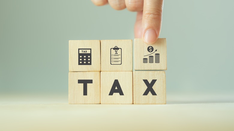 wooden blocks spelling out tax