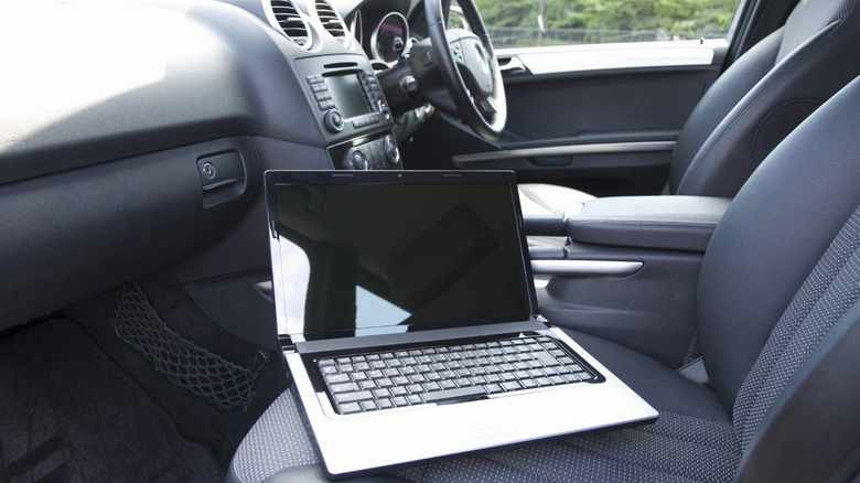 Laptop on a right-hand drive car's passenger seat