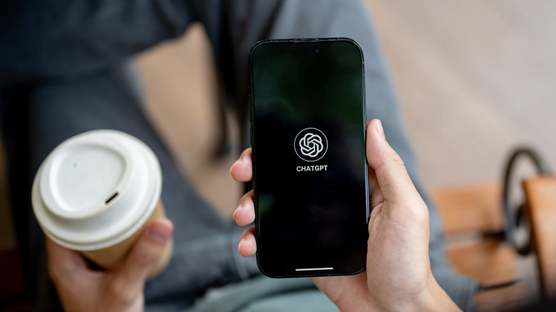 Man loading ChatGPT on his smartphone