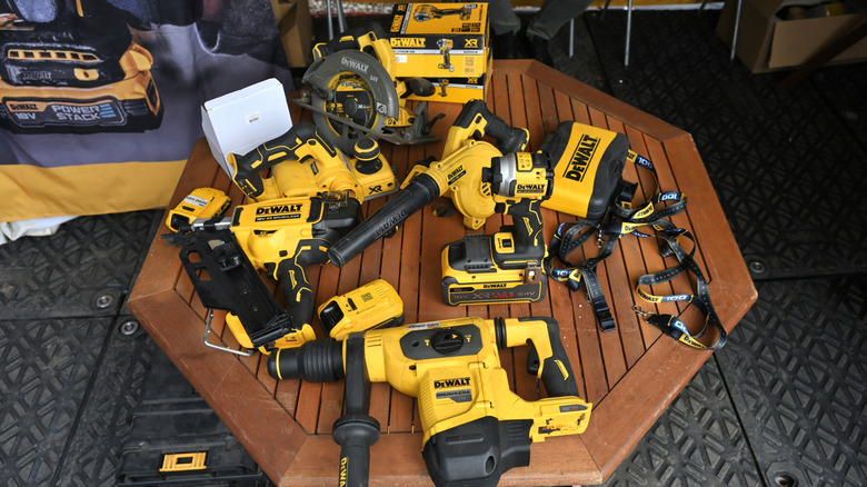 Assortment of DeWalt tools on table.