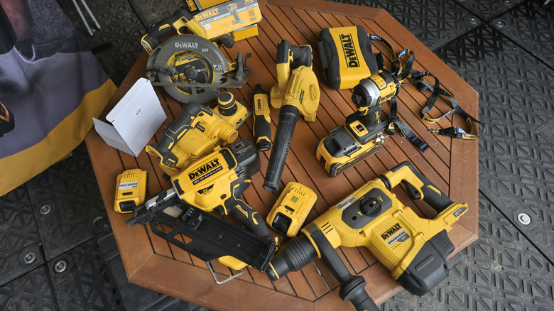 A table full of DeWalt tools.