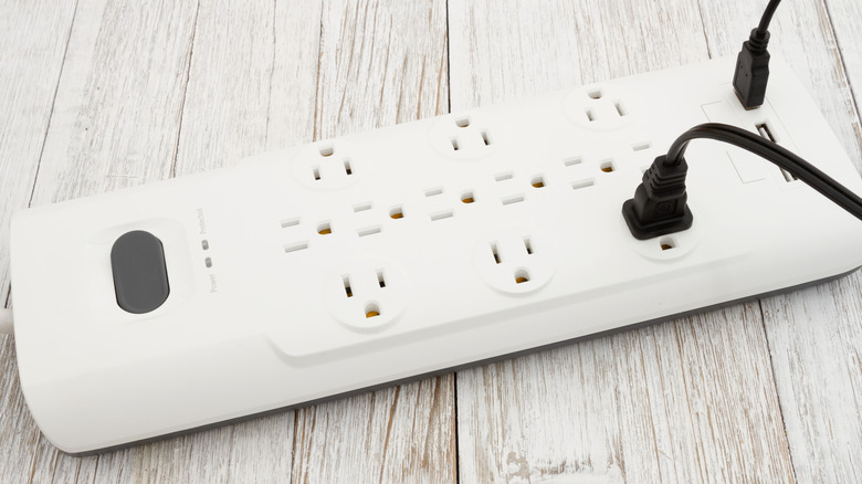 Surge protector with many sockets