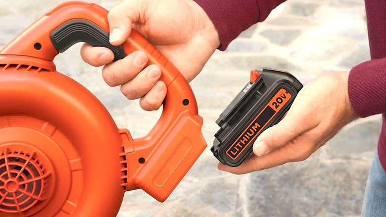 Person using Black and Decker battery