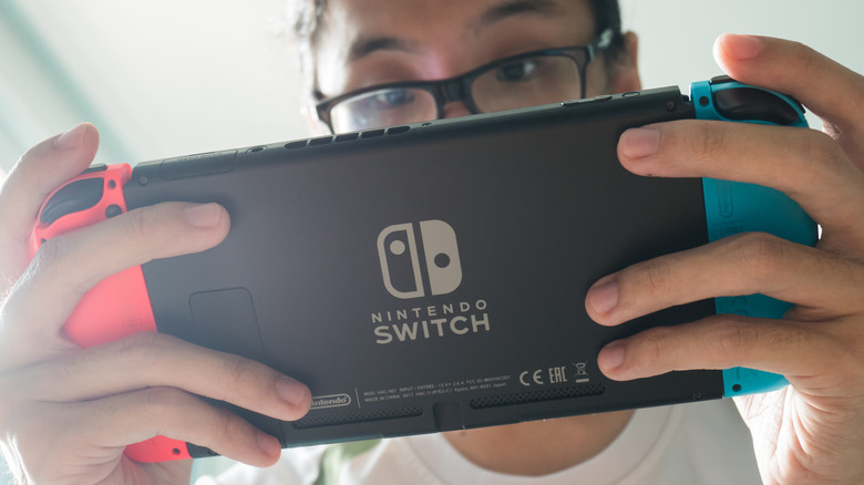 someone playing Nintendo Switch handheld mode