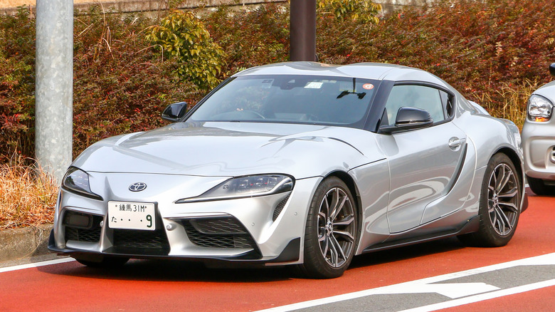 Silver Toyota Supra GR parked on the street