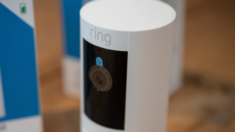 A Ring security camera on a table.