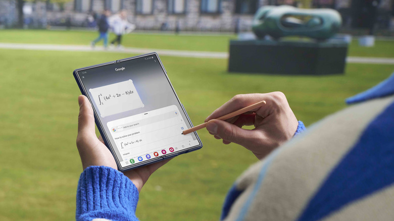 Person using an S Pen with a Samsung Galaxy Z Fold 6