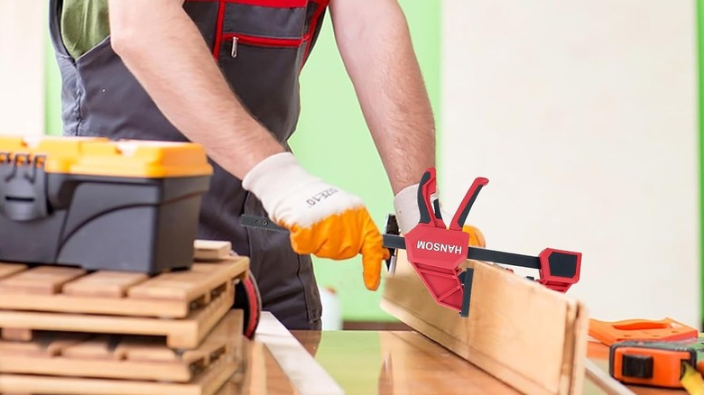 Speed clamp being used to secure two pieces of wood