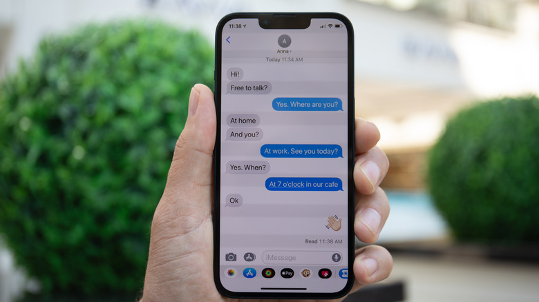Person using Apple Messages on an iPhone