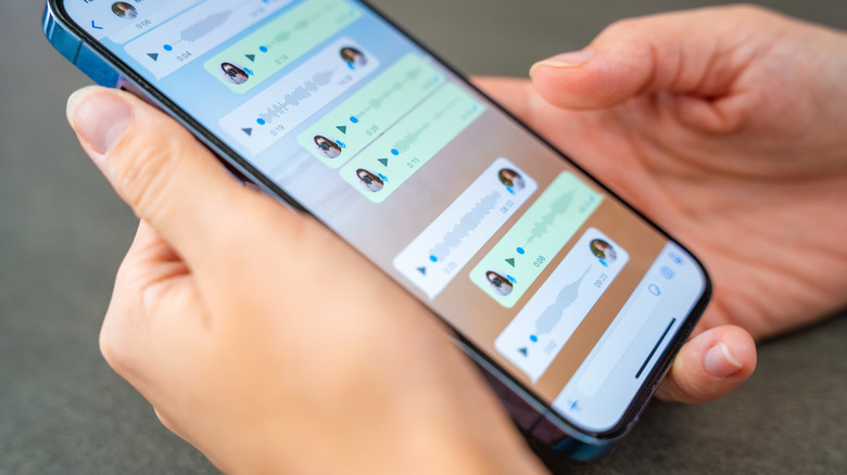 Person using WhatsApp on an iPhone