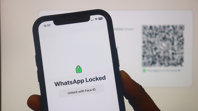 An iPhone with the WhatsApp app locked