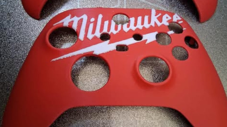 An Xbox faceplate 3D printed with a Milwaukee logo