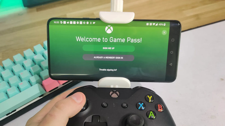An Xbox controller with a phone mounted to it using a 3D printed device