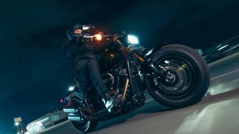 A man riding a black 2024 Harley-Davidson Fat Bob